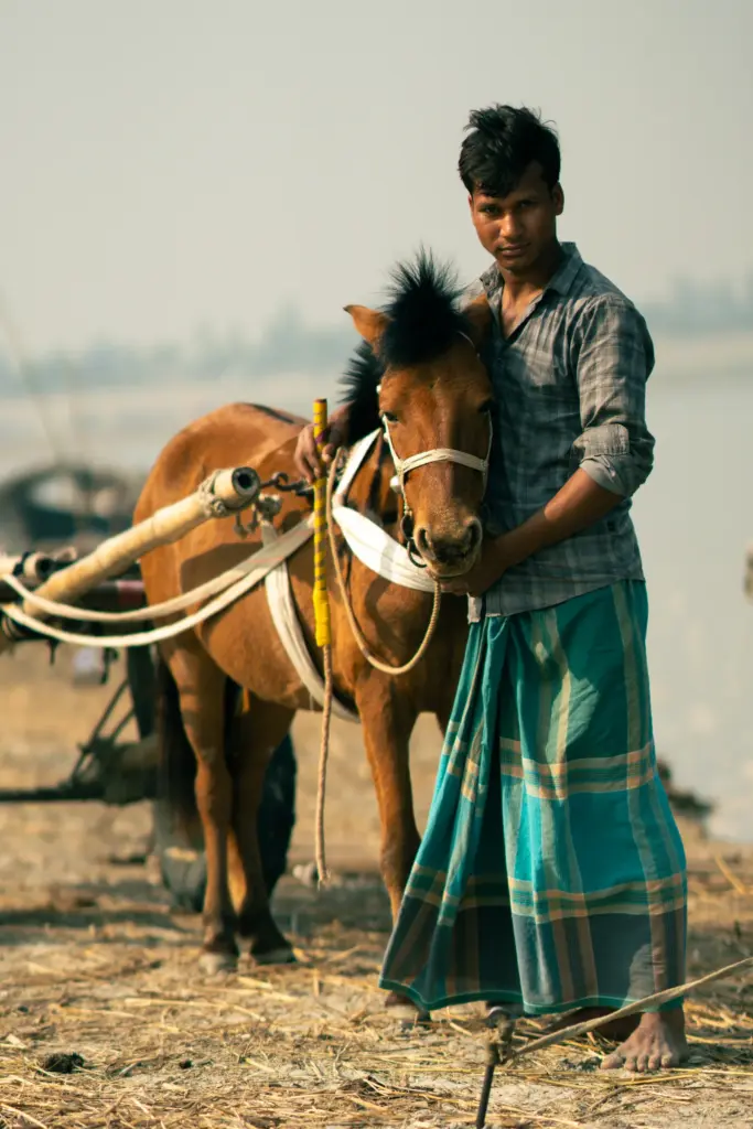 Mann mit einem Pferd · Bangladesch